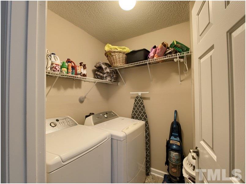 2647 Quarry Ridge Lane Raleigh, NC 27610 - Photo 11 of 18 a view of walk in closet with clothes and shoes