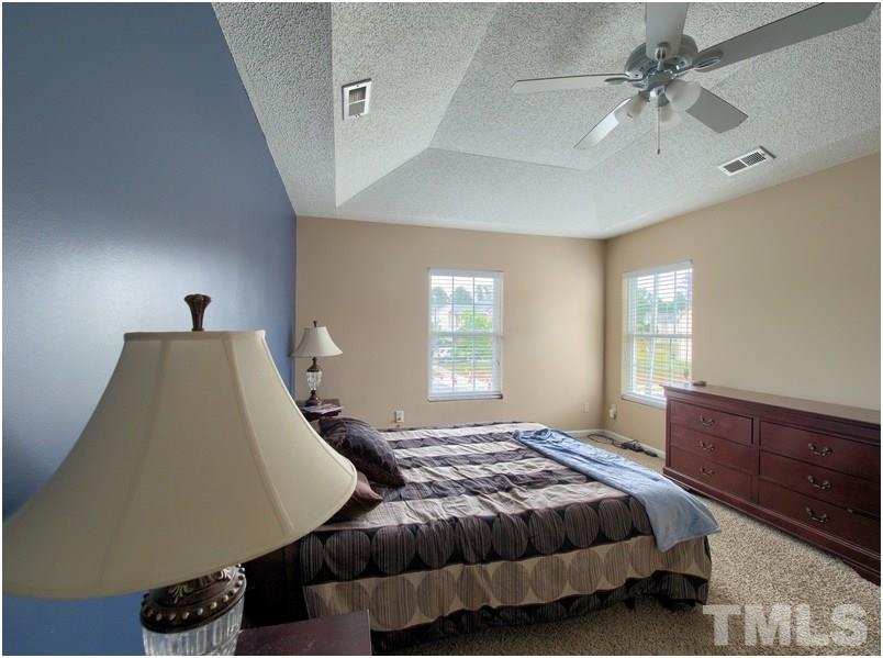 2647 Quarry Ridge Lane Raleigh, NC 27610 - Photo 15 of 18 a bedroom with a bed and window