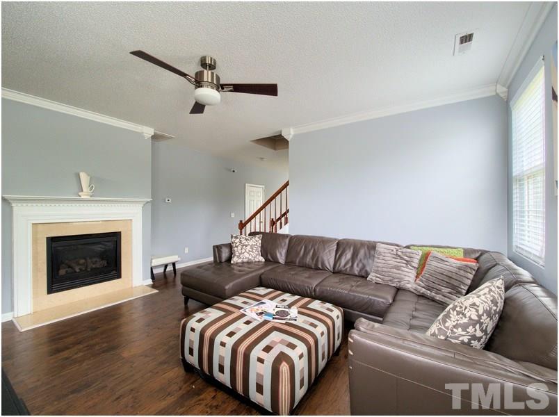 2647 Quarry Ridge Lane Raleigh, NC 27610 - Photo 3 of 18 a living room with furniture and a fireplace
