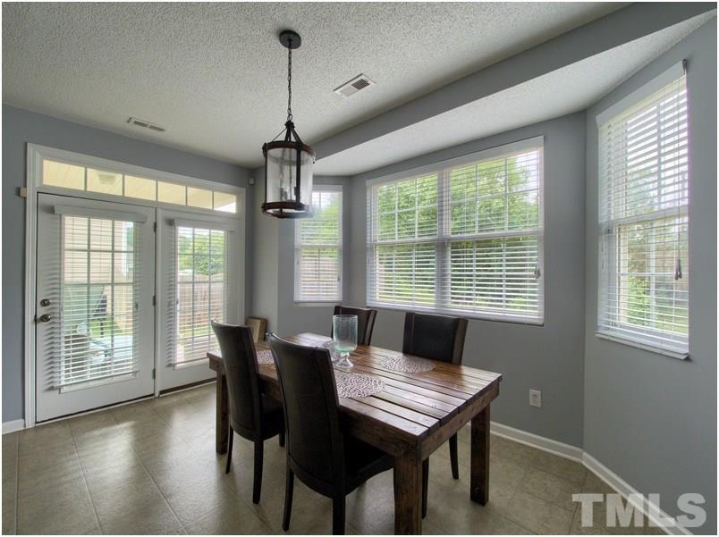 2647 Quarry Ridge Lane Raleigh, NC 27610 - Photo 6 of 18 a dining room with furniture window wooden floor