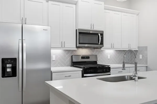 a view of kitchen with wooden floor