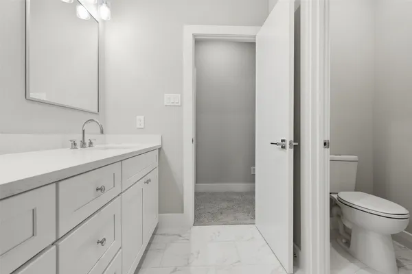 a bathroom with double sink and a mirror