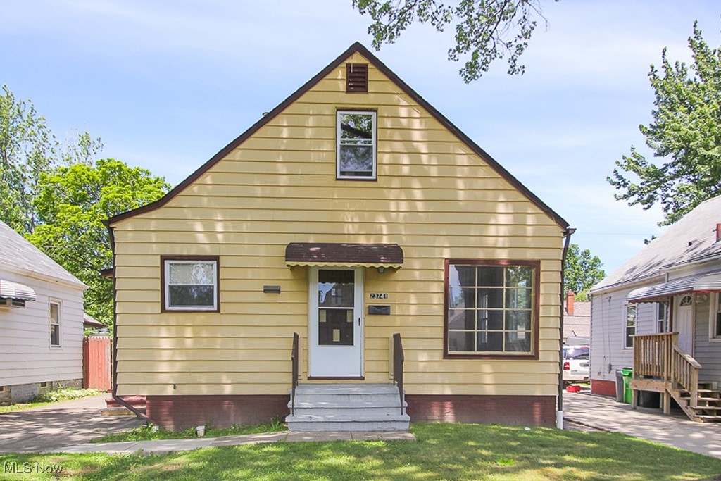 View of front of property with a front lawn