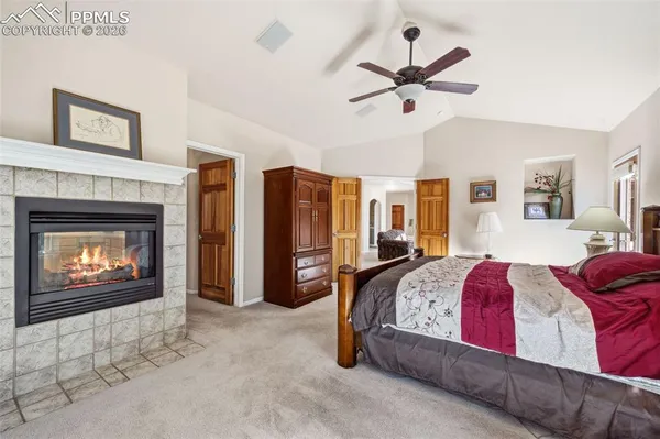 a bed room with a bed and a fireplace