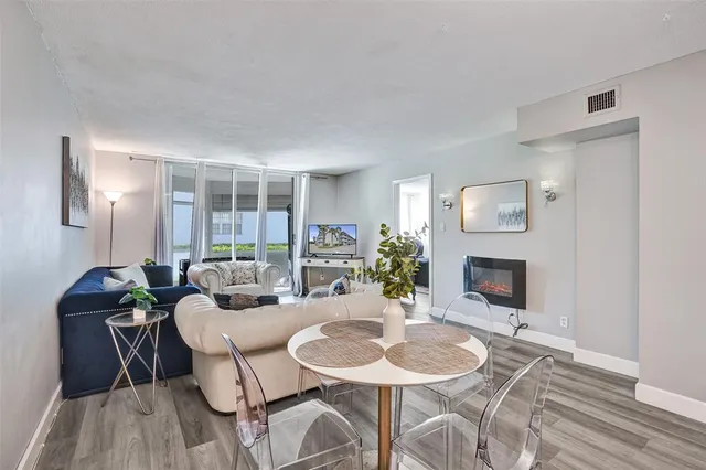 a dining room with furniture and a fireplace