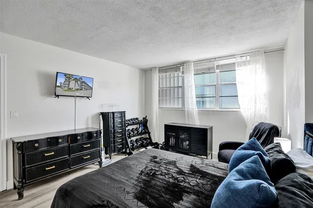 a bedroom with a bed and a fireplace