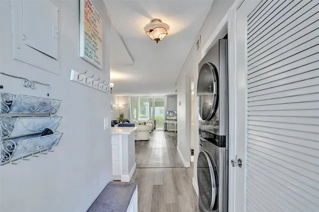 a view of a hallway with washer and dryer