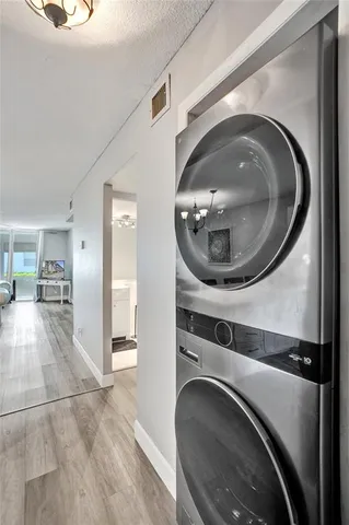 a view of a hallway with washer and dryer