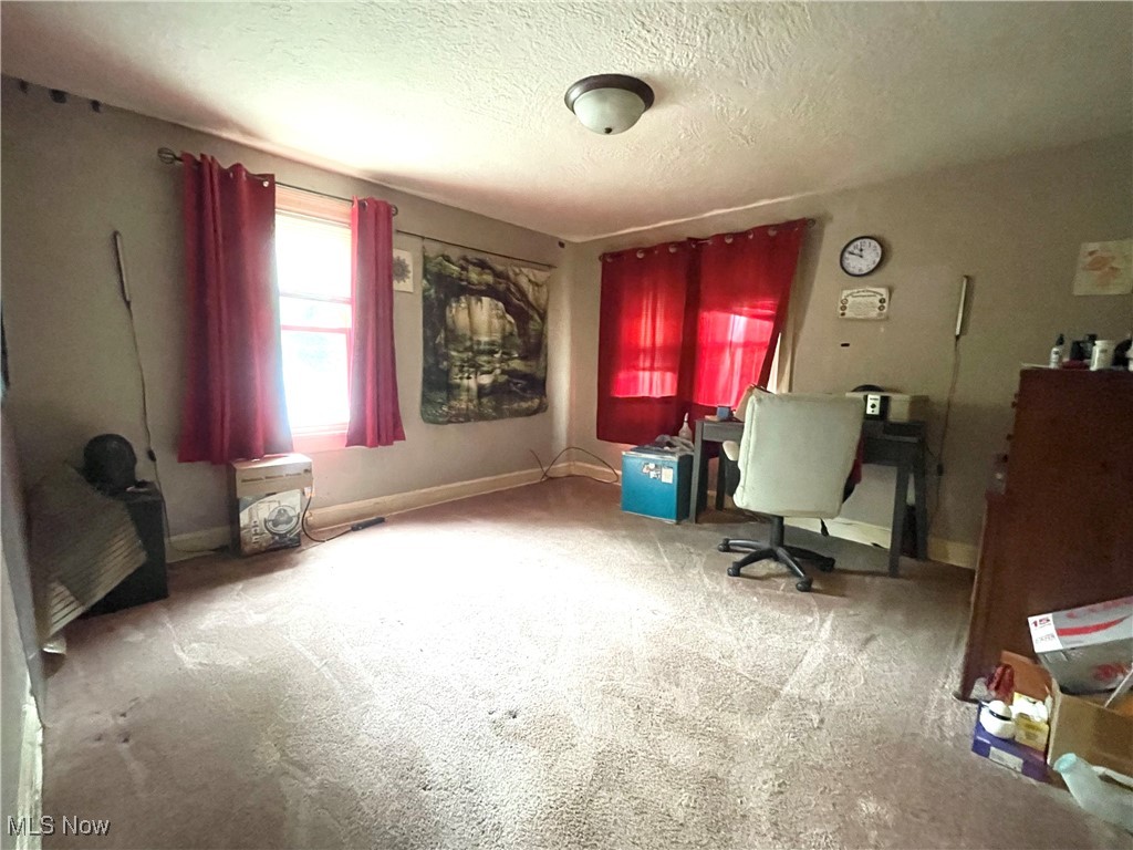 2409 Lake Rd Boulevard Northwest Canton, OH 44708 - Photo 10 of 21 Bedroom with a textured ceiling and carpet flooring