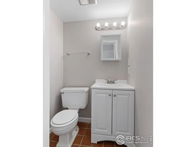 a view of a dining room with furniture and a window