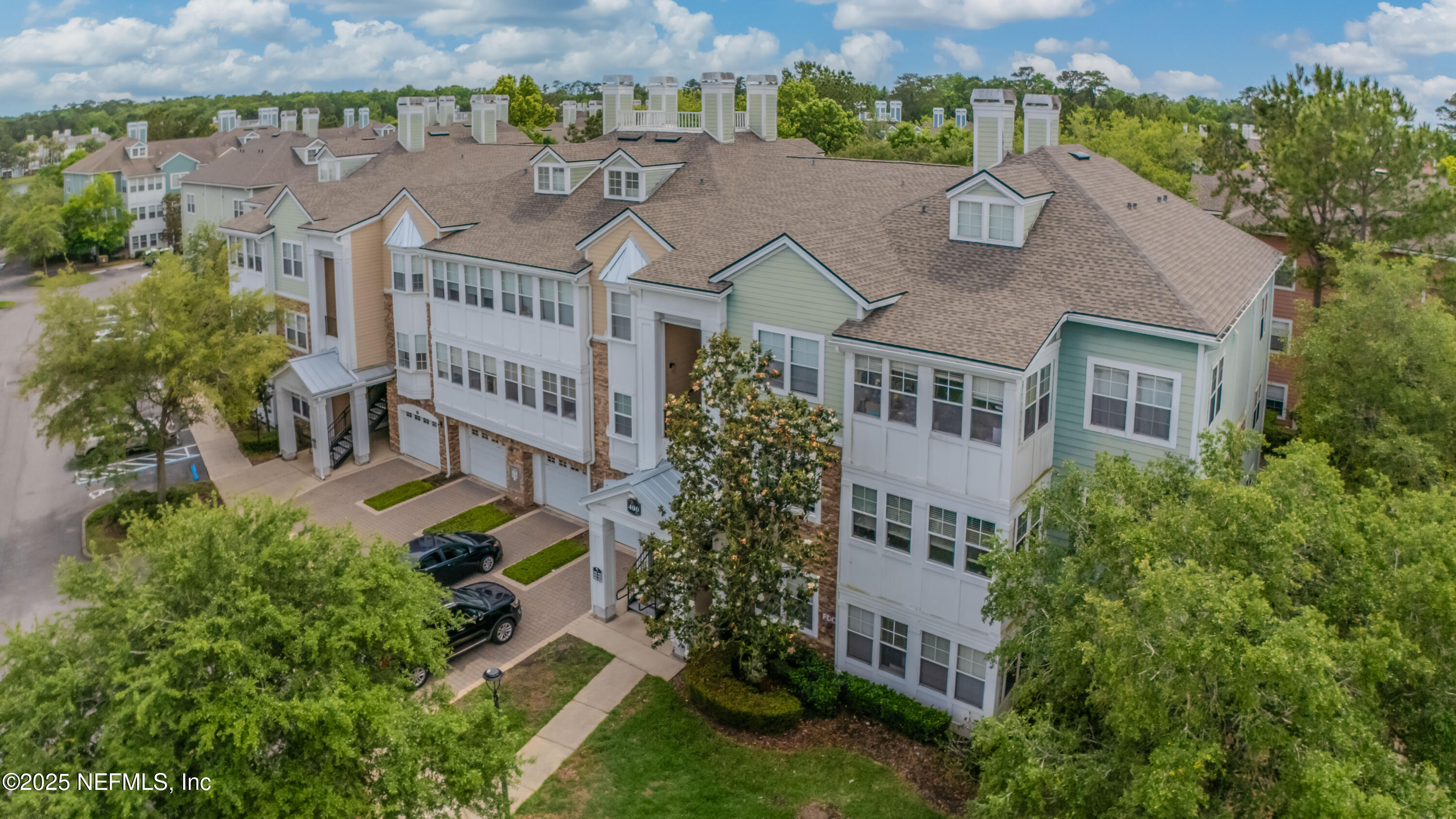 8550 Touchton Road, Unit 428 Jacksonville, FL 32216 - Photo 1 of 26 an aerial view of multiple houses with a yard