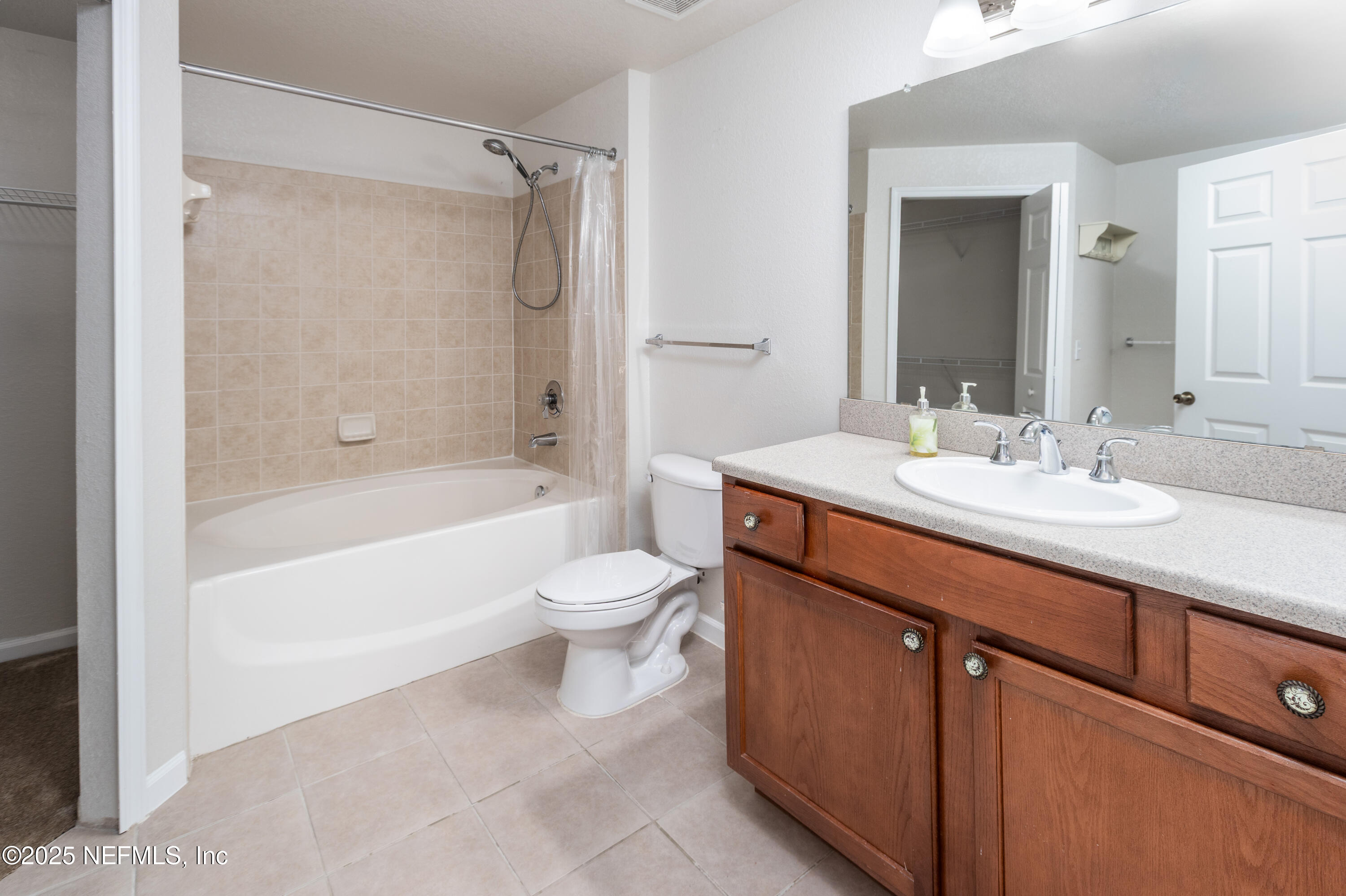 8550 Touchton Road, Unit 428 Jacksonville, FL 32216 - Photo 12 of 26 a bathroom with a sink toilet and shower