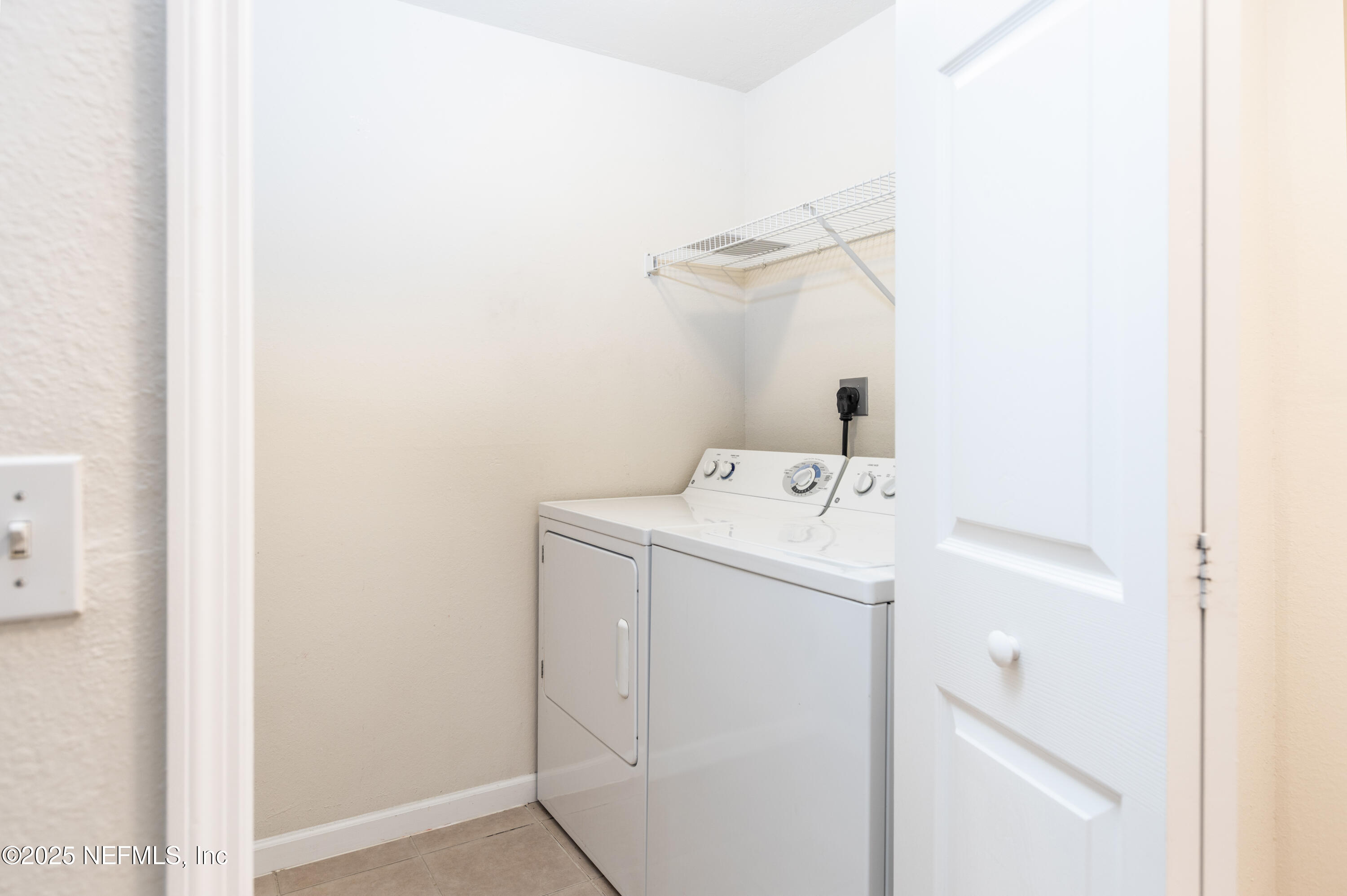 8550 Touchton Road, Unit 428 Jacksonville, FL 32216 - Photo 14 of 26 a utility room with dryer and washer