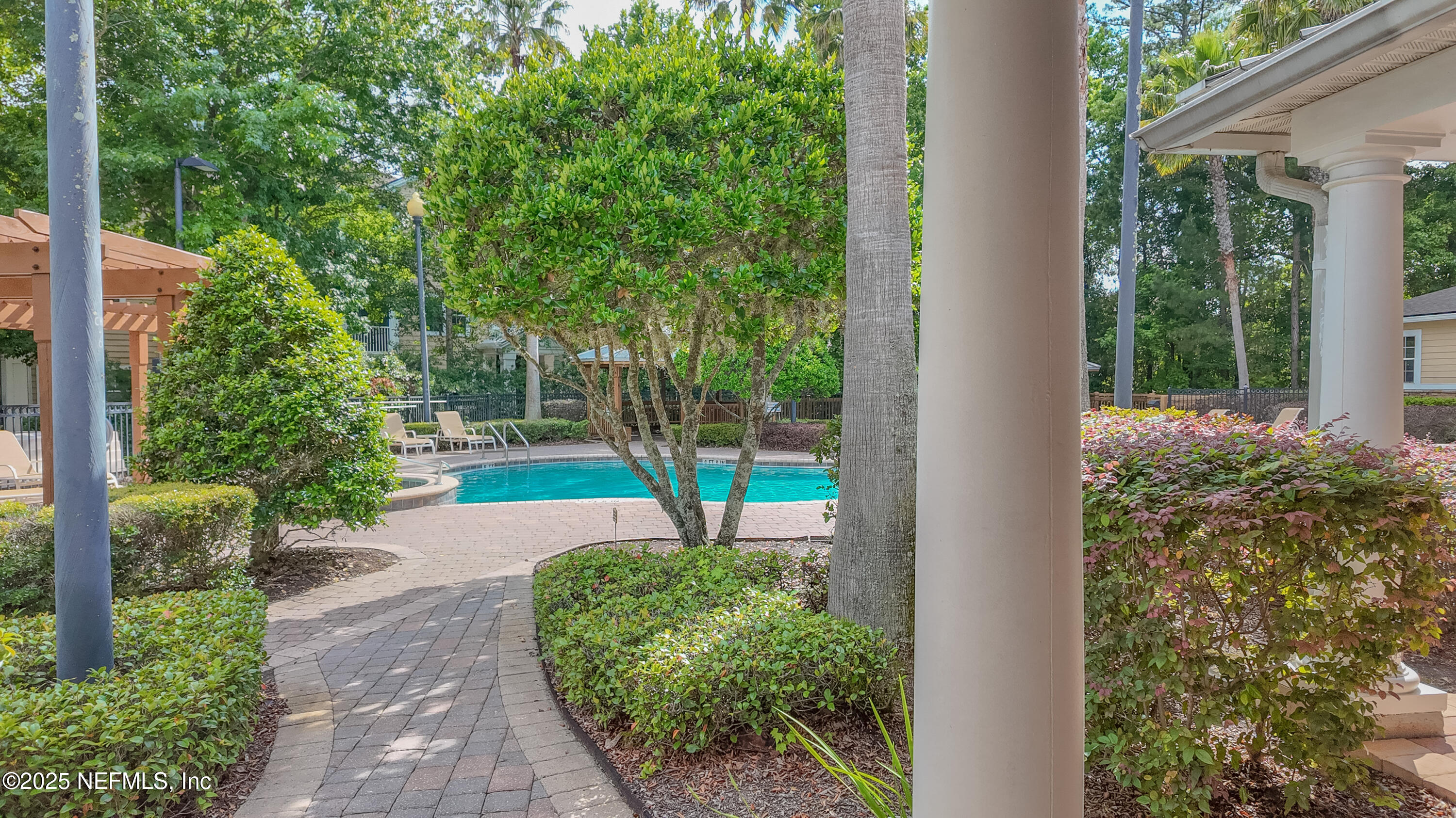 8550 Touchton Road, Unit 428 Jacksonville, FL 32216 - Photo 16 of 26 a view of a garden with potted plants
