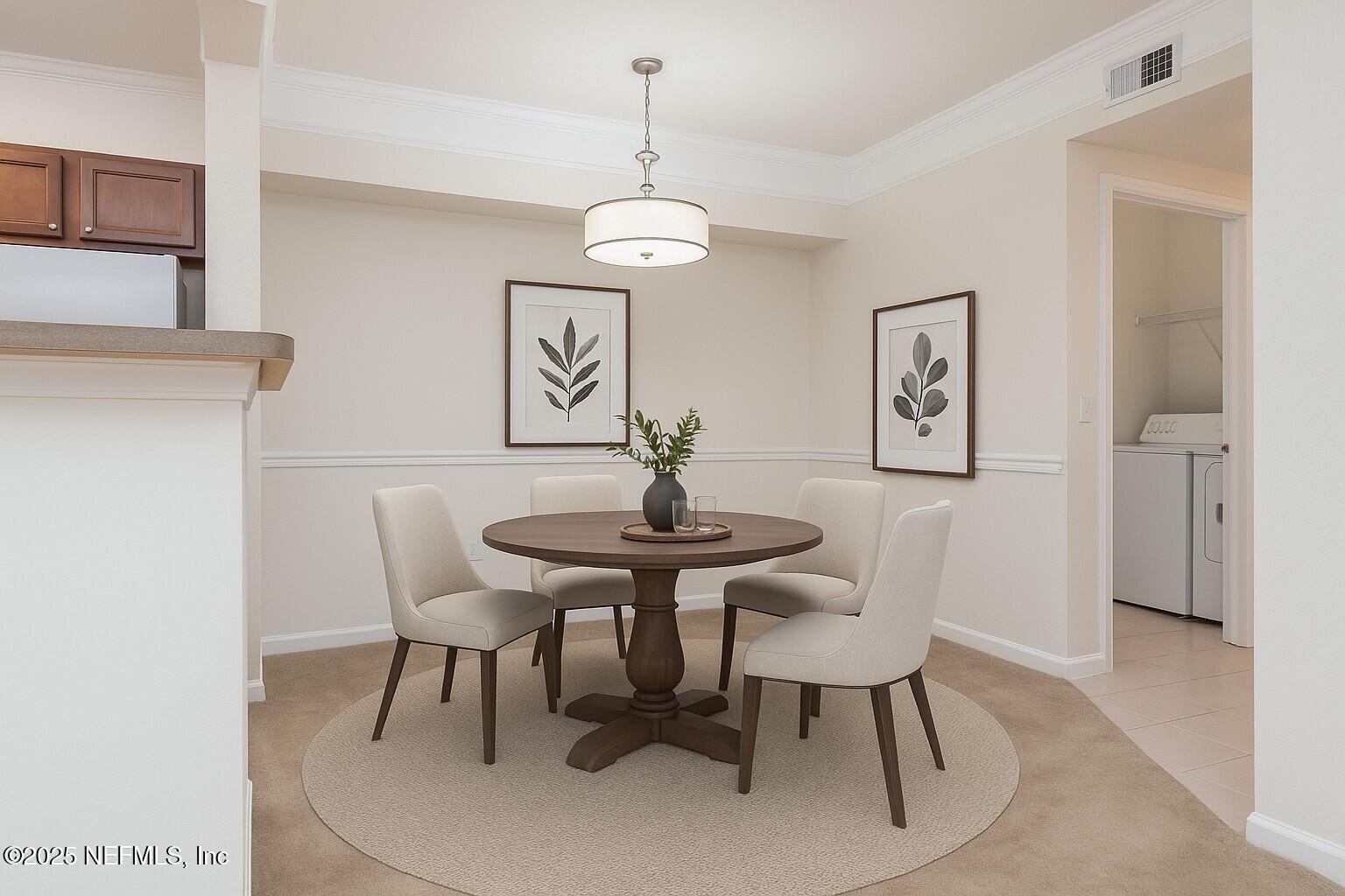 8550 Touchton Road, Unit 428 Jacksonville, FL 32216 - Photo 5 of 26 a view of a dining room with furniture and wooden floor