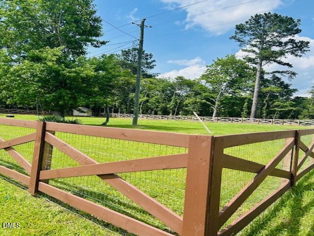 7700 Humie Olive Road Apex, NC 27502 - Photo 2 of 13 a view of outdoor space with seating area and trees around