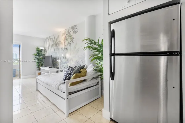 a white refrigerator freezer sitting in a kitchen