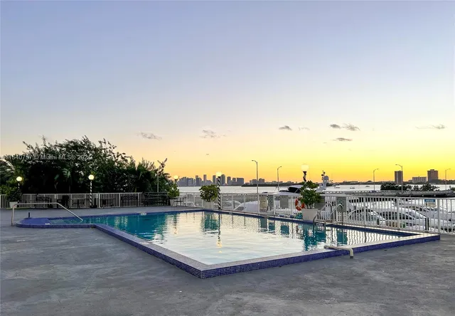 a view of a swimming pool with a lake view