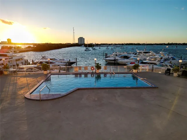 a view of a swimming pool with lounge chair
