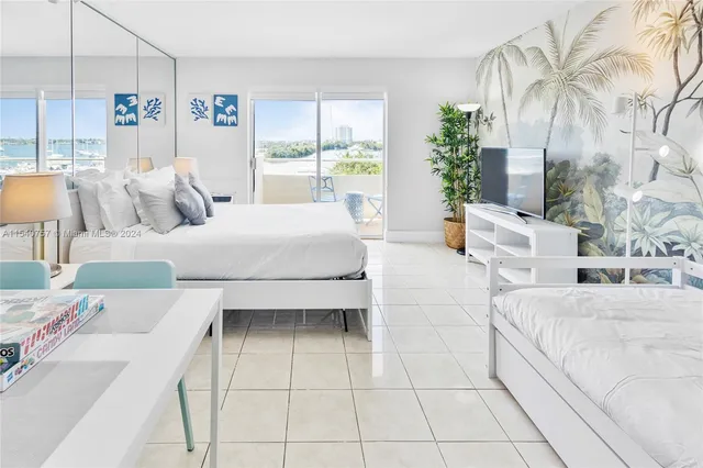 a bedroom with a bed and a table