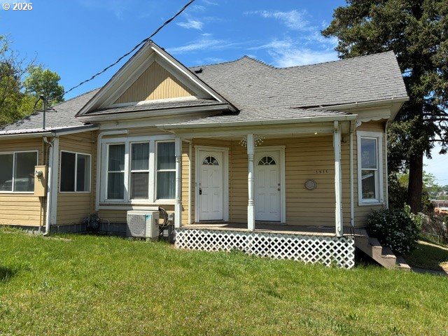 1914 Southeast Court Avenue Pendleton, OR 97801 - Photo 1 of 28 a front view of a house with a garden