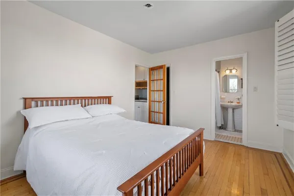 a large white bed in a white room