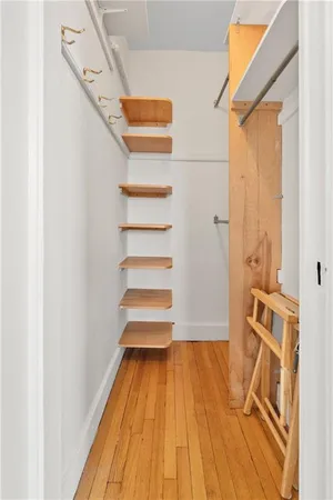 a view of a room with wooden floor and staircase