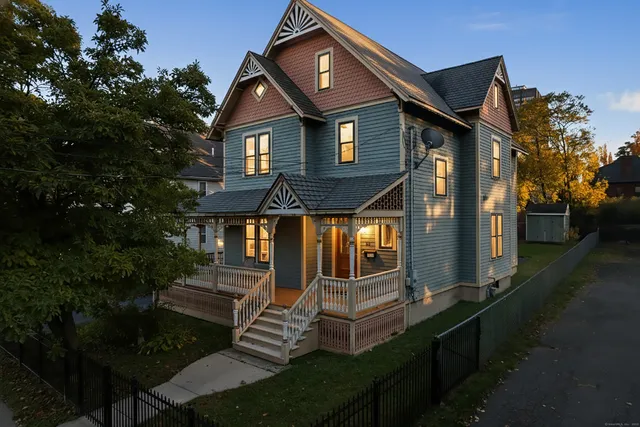 a front view of house with yard and green space