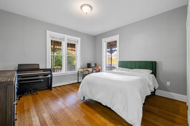 a bedroom with a bed and a dresser