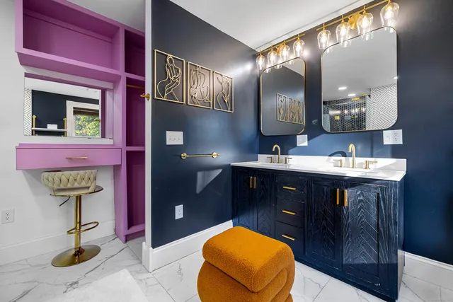 a bathroom with a sink a vanity and a mirror