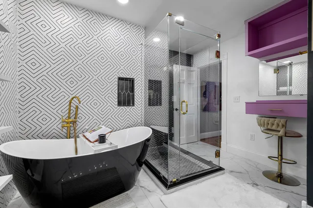 a living room with furniture a rug and a chandelier