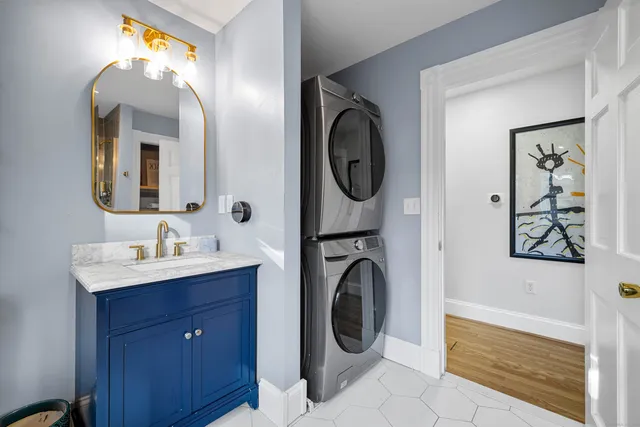 a bathroom with a sink a mirror and a bathtub