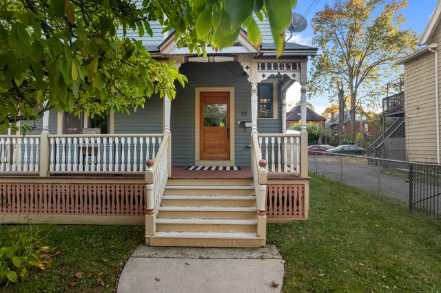 a view of a house with a small yard and plants