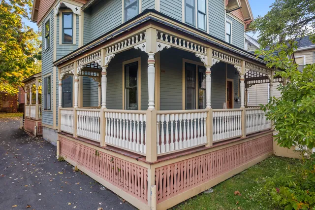 a view of a house with a yard and deck