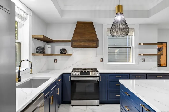 a kitchen with cabinets and appliances