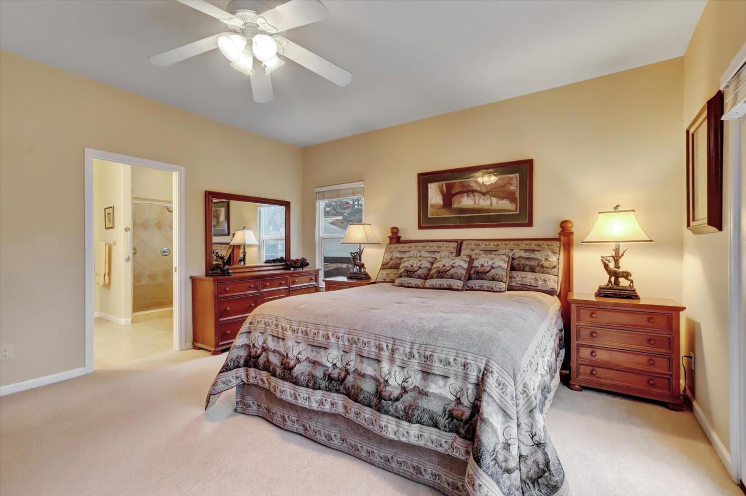 17036 Alice Way Grass Valley, CA 95949 - Photo 34 of 58 a bedroom with a bed and dresser