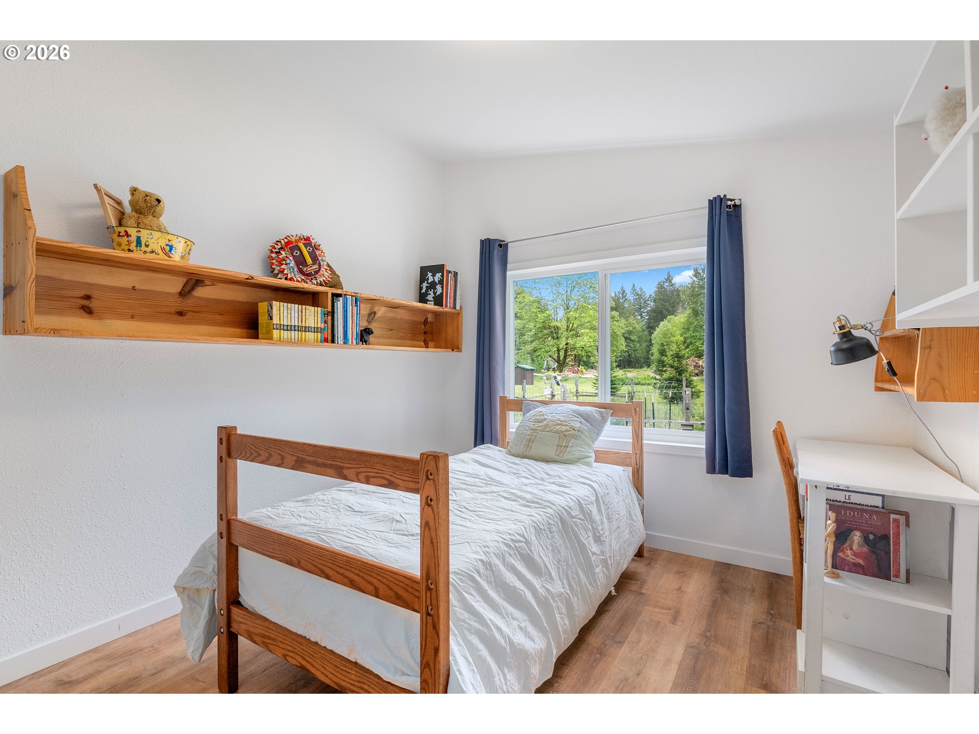 451 Cannavinna Road Carson, WA 98610 - Photo 19 of 33 a bedroom with furniture and a large window