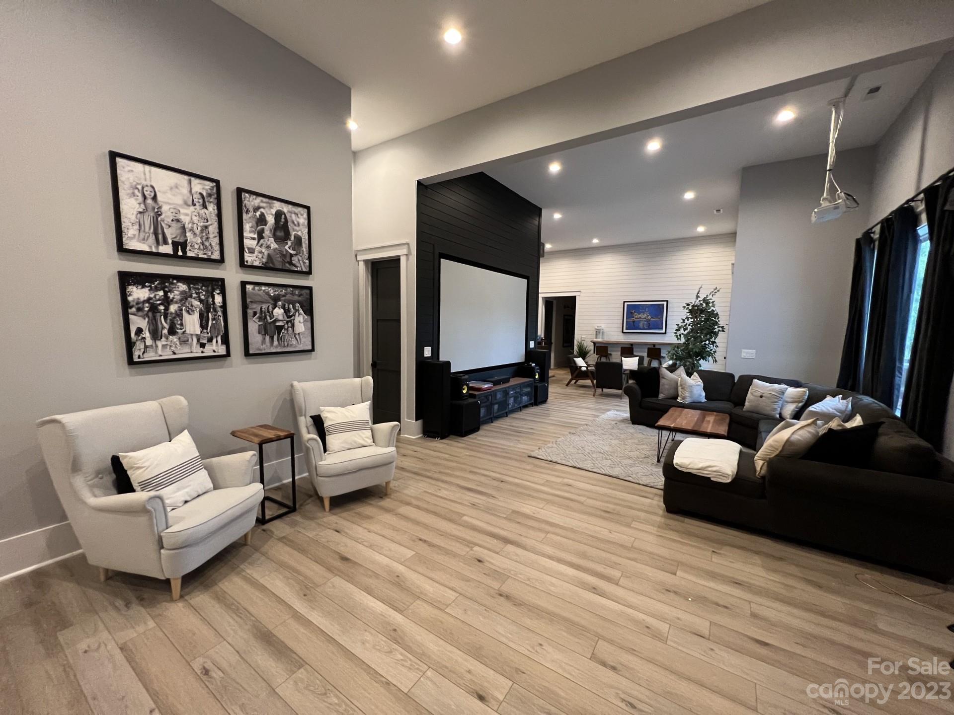 370 Calming Way Tega Cay, SC 29708 - Photo 15 of 24 a living room with furniture and a wooden floor