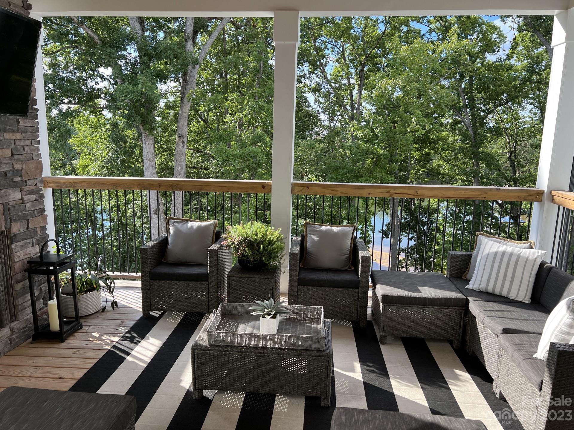 370 Calming Way Tega Cay, SC 29708 - Photo 8 of 24 a balcony with furniture and a potted plant