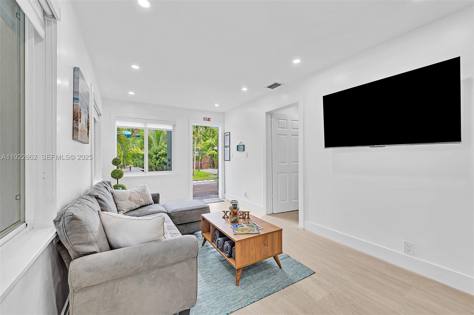 1960 Riverside Drive Fort Lauderdale, FL 33312 - Photo 11 of 89 a living room with furniture and a flat screen tv