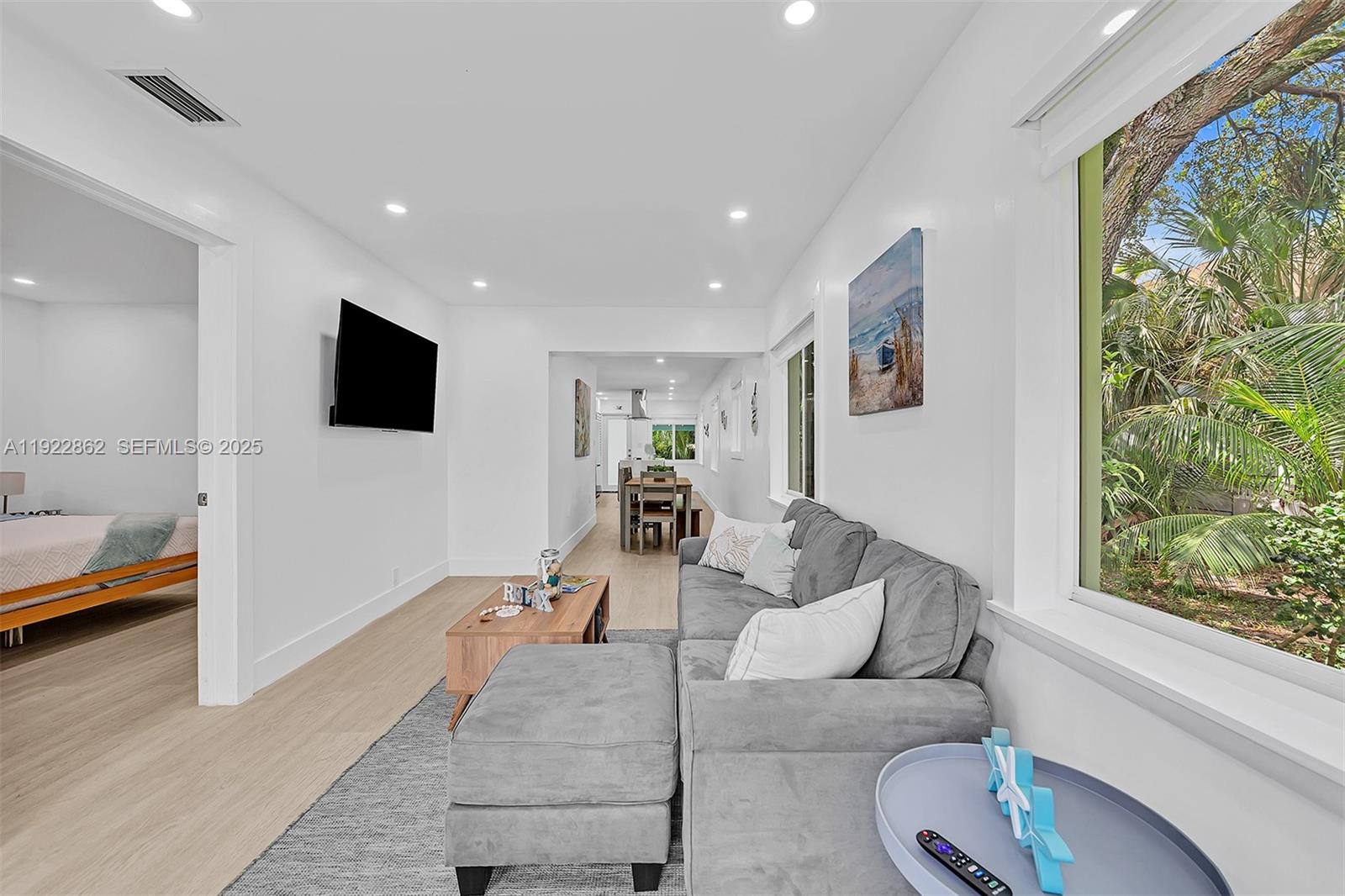 1960 Riverside Drive Fort Lauderdale, FL 33312 - Photo 15 of 89 a living room with furniture and a flat screen tv