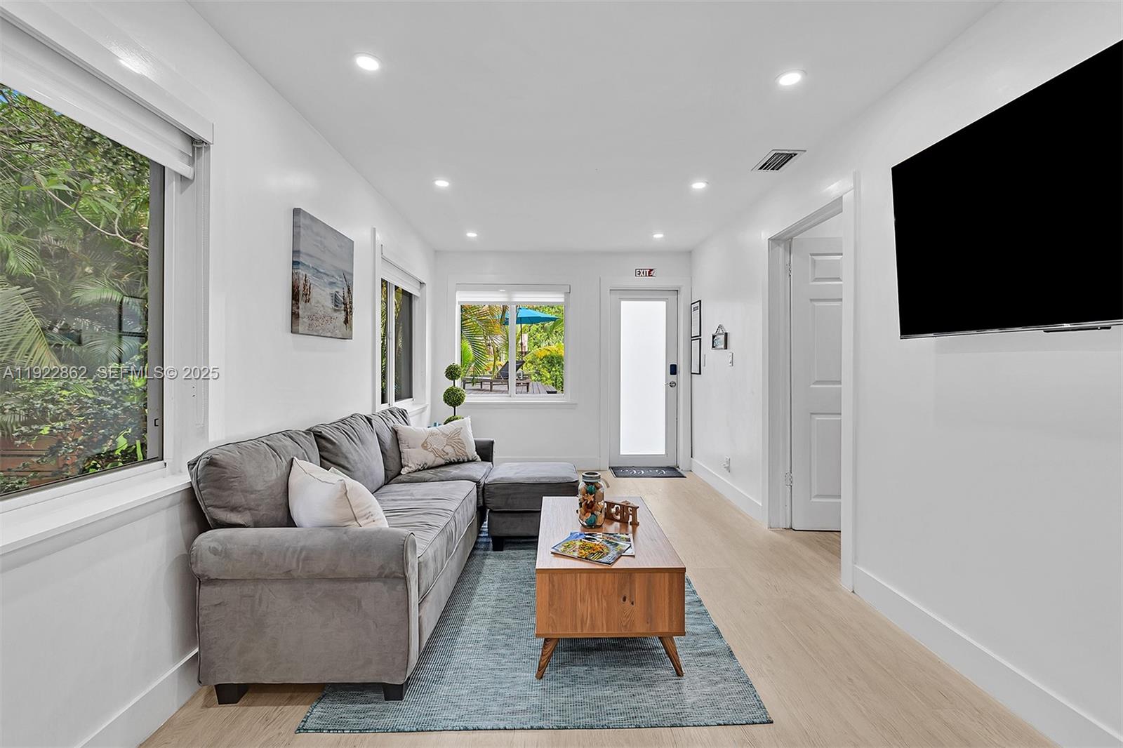 1960 Riverside Drive Fort Lauderdale, FL 33312 - Photo 16 of 89 a living room with furniture and a flat screen tv