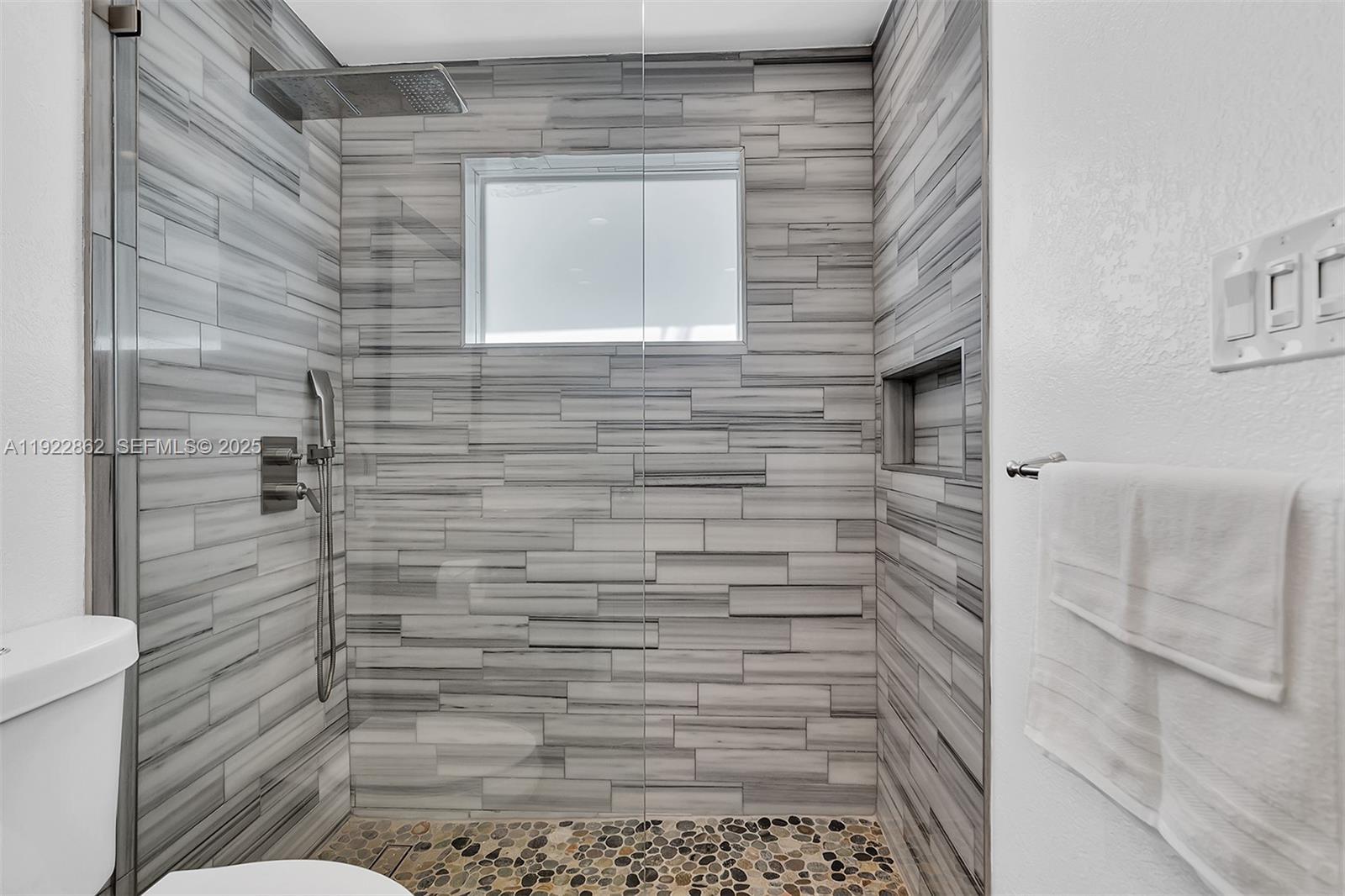 1960 Riverside Drive Fort Lauderdale, FL 33312 - Photo 23 of 89 a bathroom with a toilet and a shower