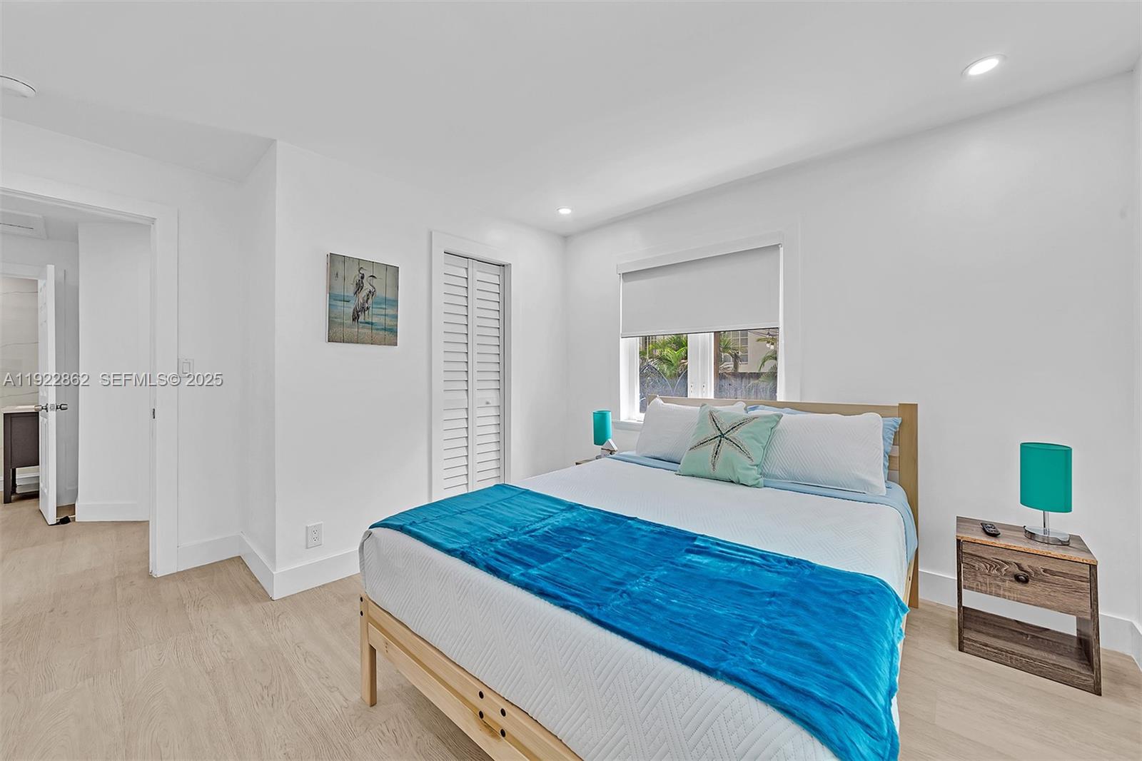 1960 Riverside Drive Fort Lauderdale, FL 33312 - Photo 48 of 89 a bedroom with a bed and a couch