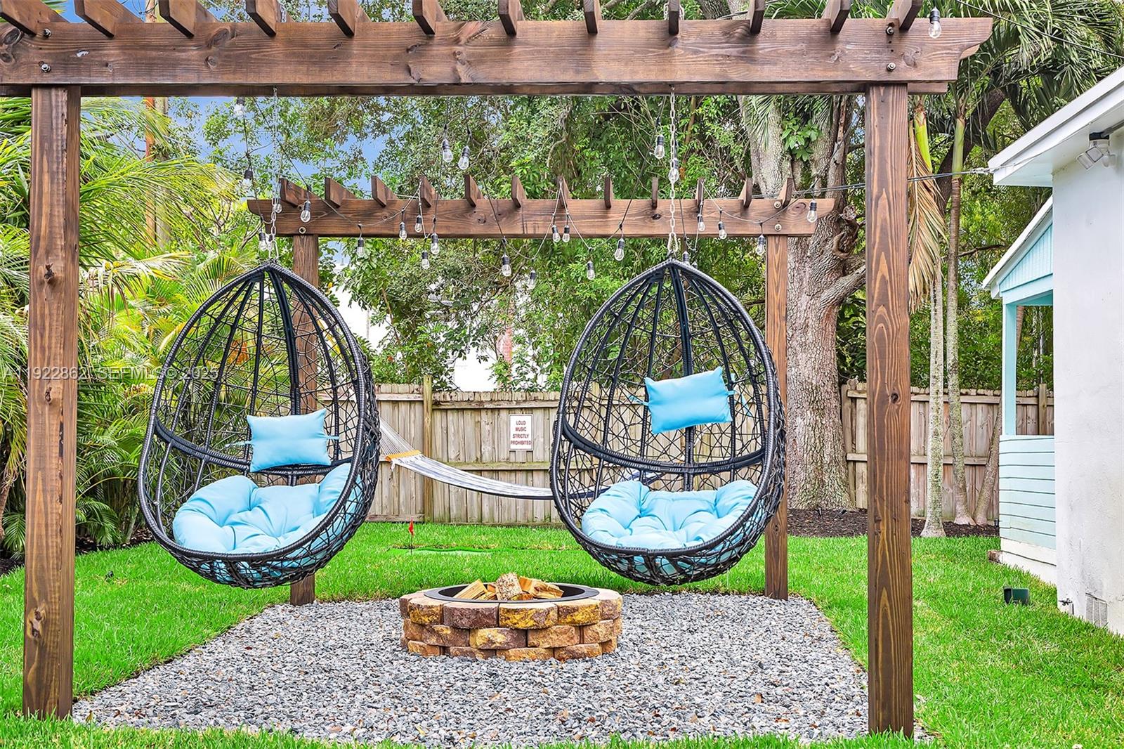 1960 Riverside Drive Fort Lauderdale, FL 33312 - Photo 5 of 89 a view of a chair and table in backyard of the house