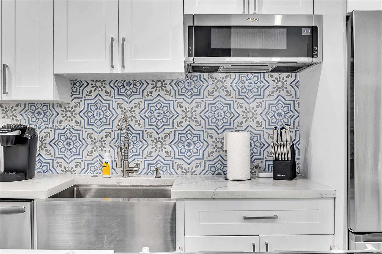 1960 Riverside Drive Fort Lauderdale, FL 33312 - Photo 55 of 89 a kitchen with a microwave and cabinets