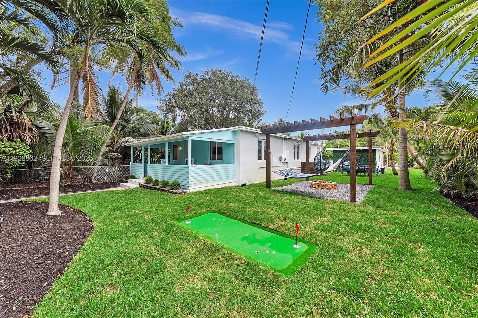 1960 Riverside Drive Fort Lauderdale, FL 33312 - Photo 64 of 89 a view of a house with backyard and a tree