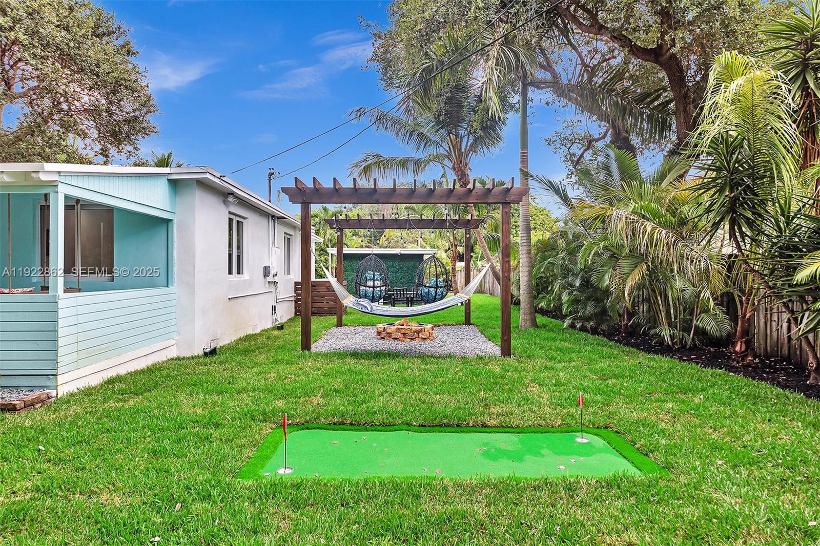 1960 Riverside Drive Fort Lauderdale, FL 33312 - Photo 65 of 89 a view of a house with a yard porch and sitting area