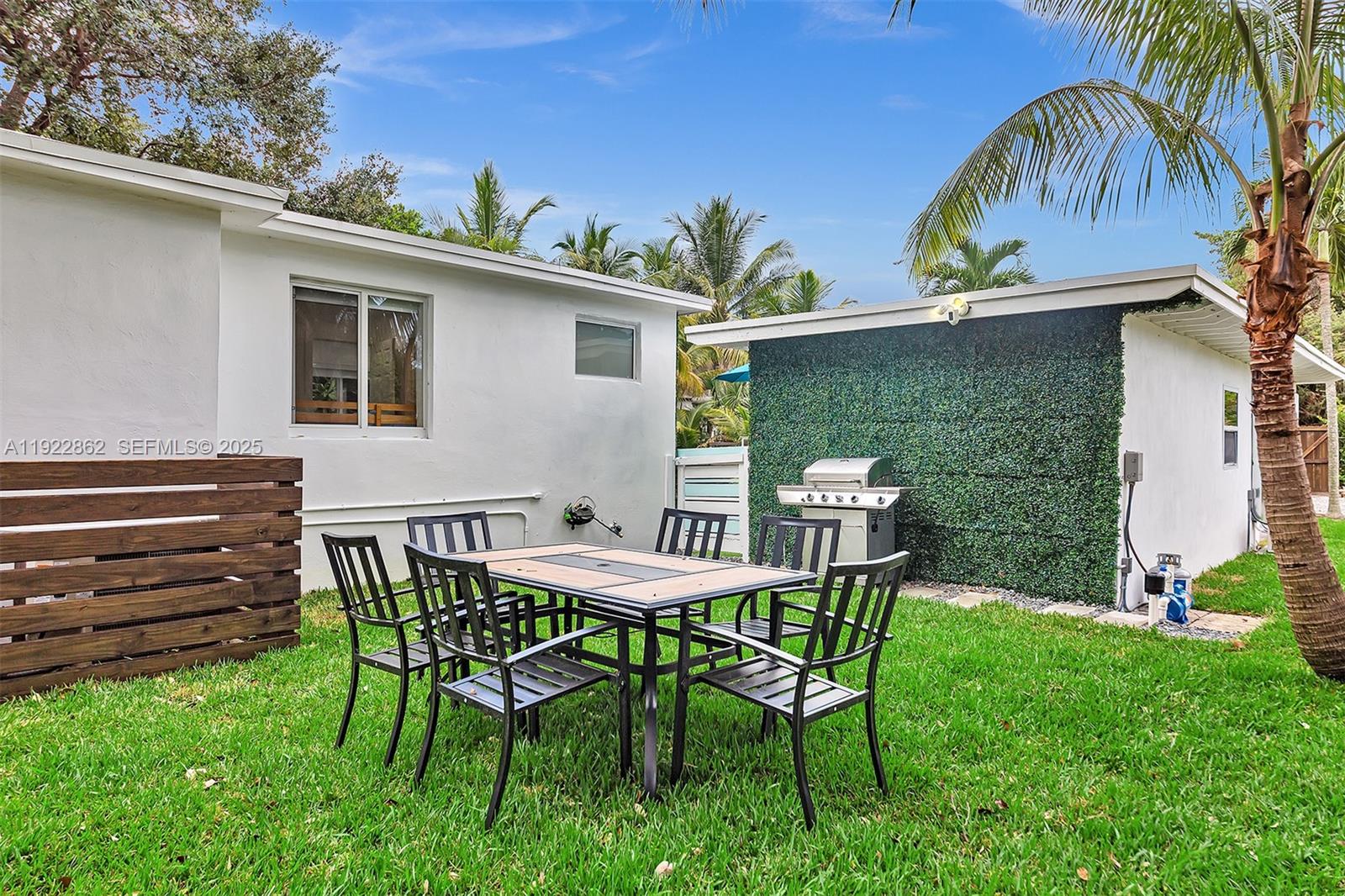 1960 Riverside Drive Fort Lauderdale, FL 33312 - Photo 71 of 89 a view of a chair and table in backyard of the house
