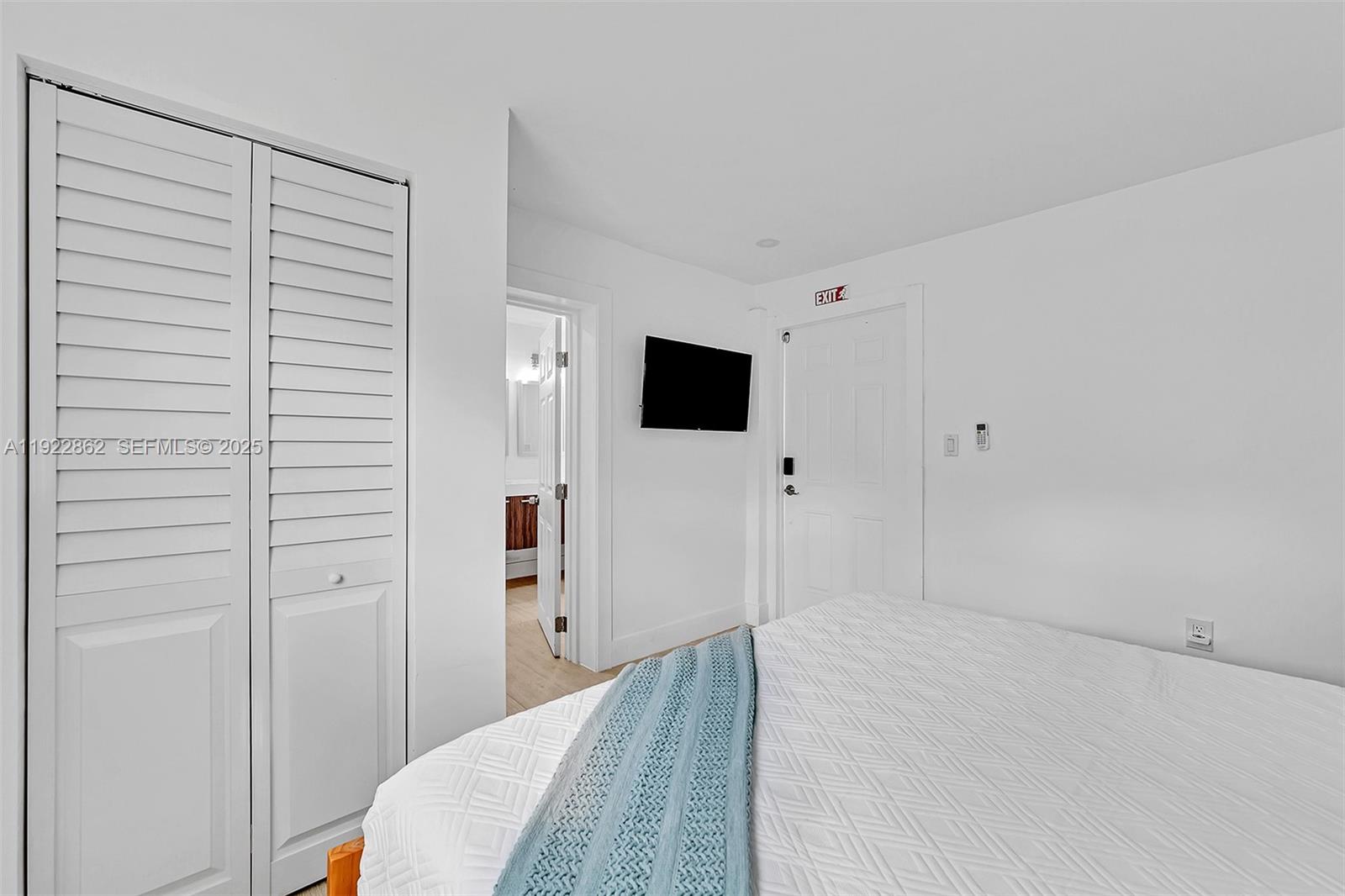 1960 Riverside Drive Fort Lauderdale, FL 33312 - Photo 8 of 89 a bedroom with a bed and a flat screen tv